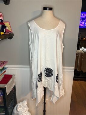 White Sleeveless Asymmetric Tunic with Black Rosette Accents